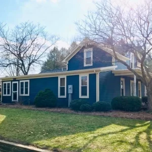 Roof replacement on blue house