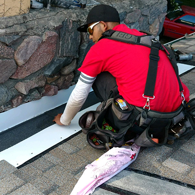Gean Roofing adding flashing around a chiminey