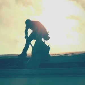 Removing Shingles with the sun behind creating shadows